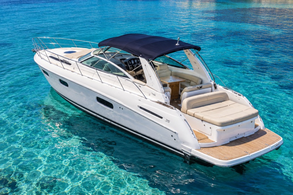Private white yacht at anchor in a turquoise bay off the Cyprus coast
